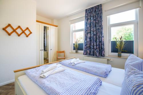 Borkum Ferienhaus Daheim - Wuldegapstraße 11 Schlafzimmer EG3