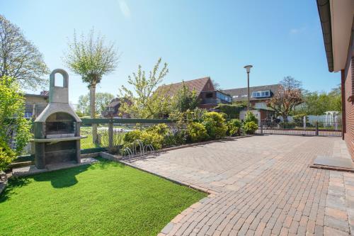 Borkum Ferienhaus Daheim - Wuldegapstraße 11 Aussenansicht Grilleck