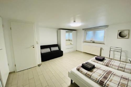 Borkum Ferienhaus Nordseeperle - Schlafzimmer mit Ausziehcouch