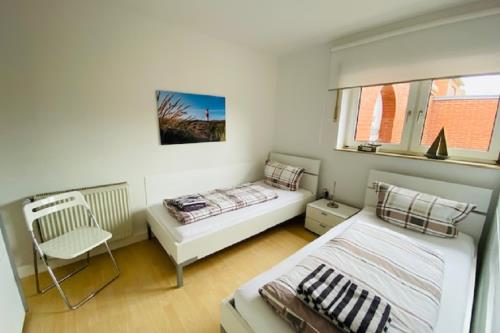 Borkum Ferienhaus Nordseeperle - Schlafzimmer mit zwei Einzelbetten