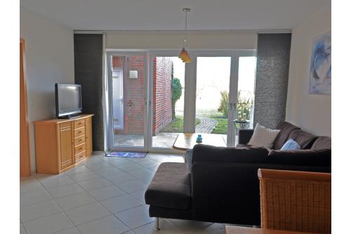 Borkum Ferienwohnung Düne 47 (Nessen) - Wohnzimmer mit Terrasse