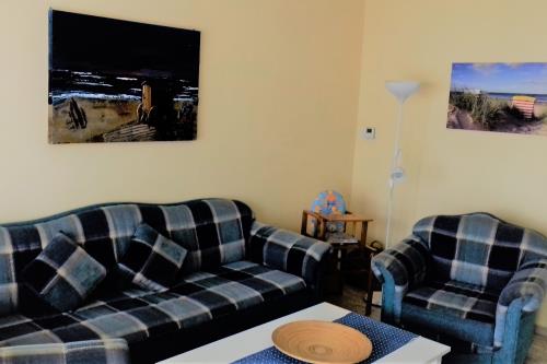 Borkum Ferienwohnung Monasteria am Südstrand - Wohnzimmer Sitzecke