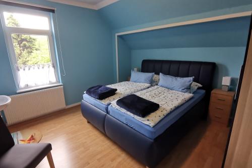 Borkum Ferienwohnung Haus Dina Sillus - Wohnung 2 Leuchtturm - Das blaue Schlafzimmer