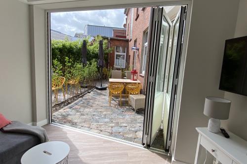 Borkum Ferienwohnung Haus Windröschen - App. 2 - Appartement 2 • Wohnzimmer Veranda