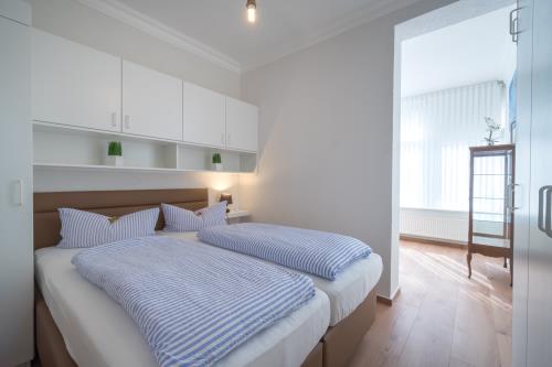 Borkum Ferienwohnung Hotel Windrose Ferienappartements - Krabbenfischer - Schlafzimmer