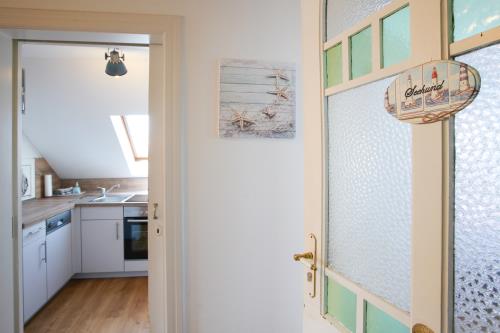 Borkum Ferienwohnung Hotel Windrose Ferienappartements - Seehund - Berg Hotel Windrose Seehund Eingang Kuec