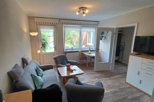 Borkum Ferienwohnung LÜTTJE HUNK - Lüttje Hunk - Wohnzimmer mit Sitzecke