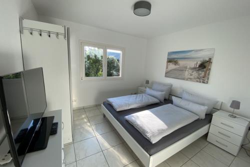 Borkum Ferienwohnung Top Lounge Borkum - Top Lounge I - Schlafzimmer mit Rolläden