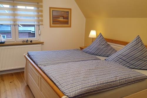 Borkum Ferienhaus Zum Reitstall - Schlafzimmer 1