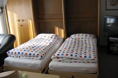 Borkum Ferienwohnung am Südstrand - Am Südstrand - Zwei Einzelbetten im Wohnzimmer