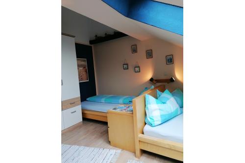 Borkum Ferienwohnung Oskar - Schlafzimmer